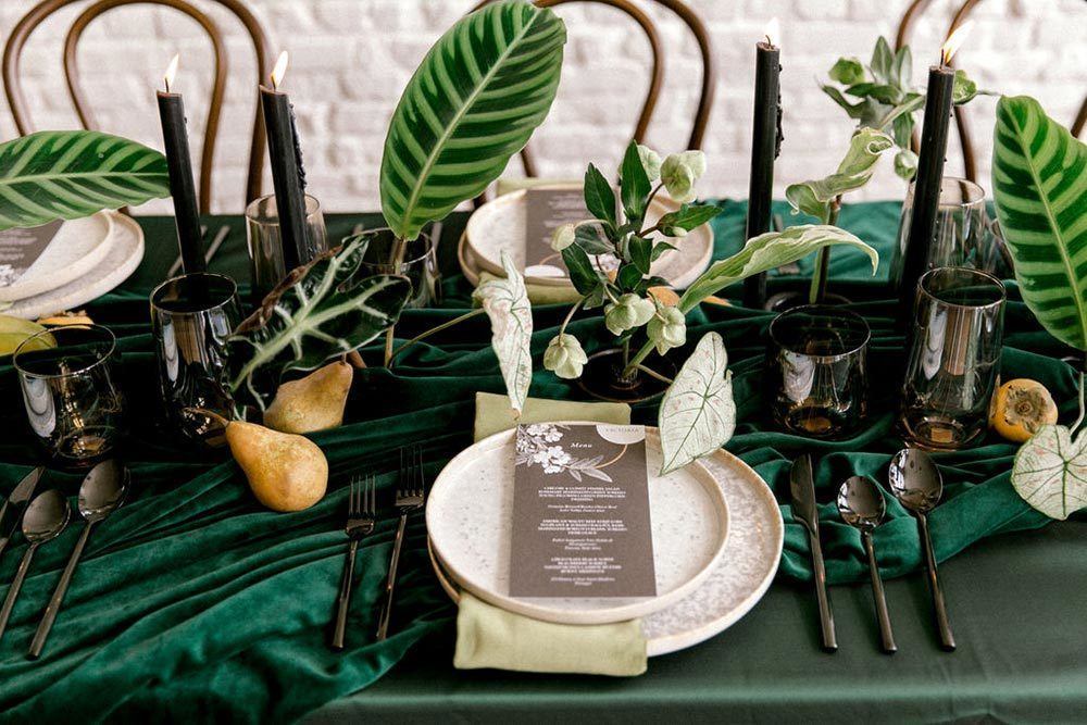 textured clay plates and vintage botanical menu with green linens and napkins
